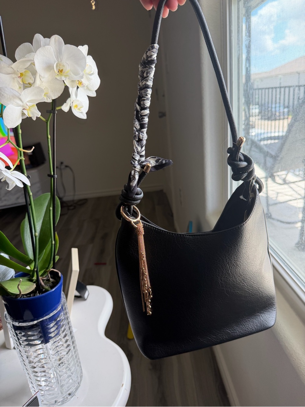 Black Women's Shoulder Bag with Scarf-Wrapped Strap and Gold Tassel